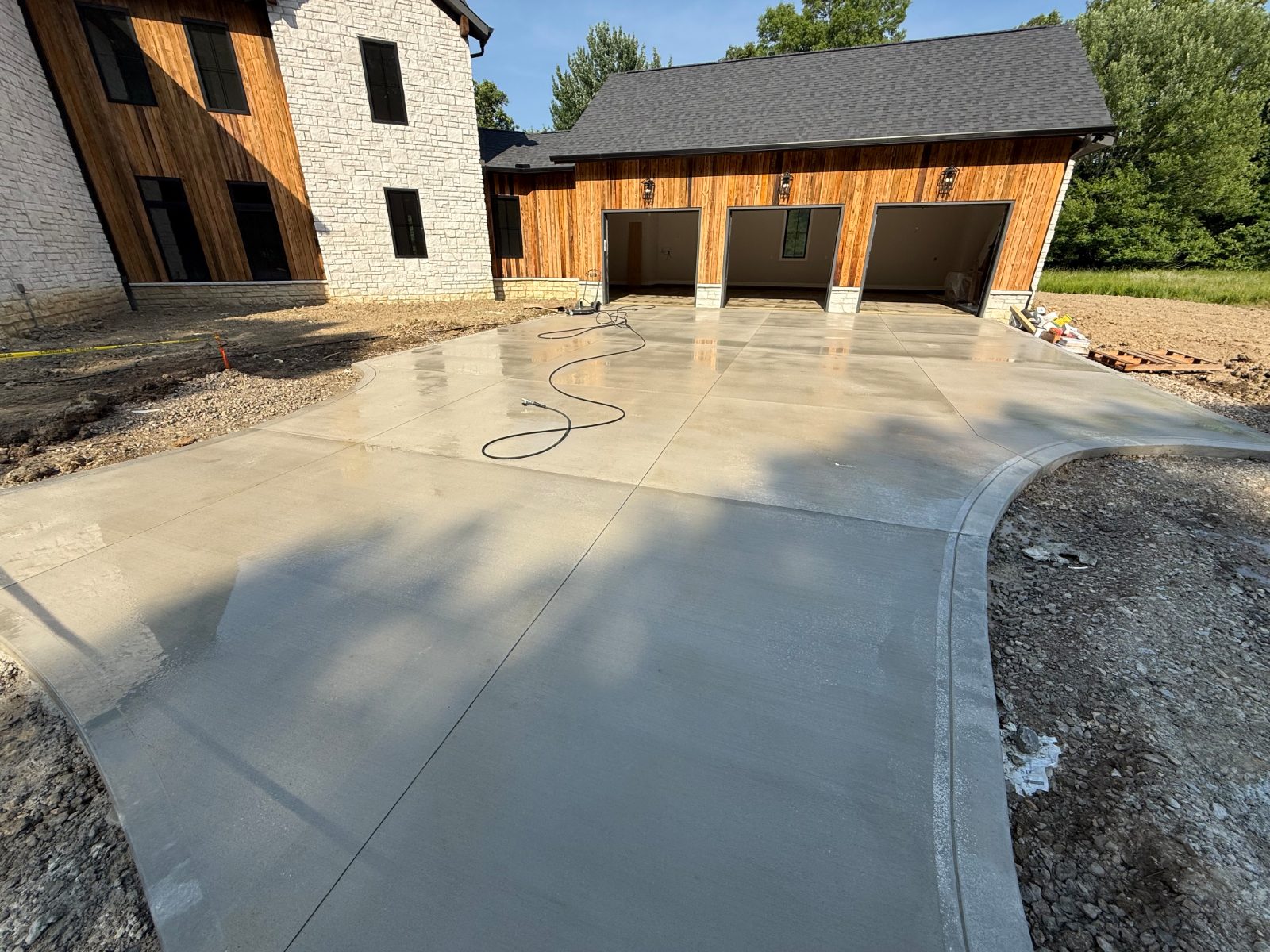 Freshly washed concrete driveway and garage apron at a Central Ohio home