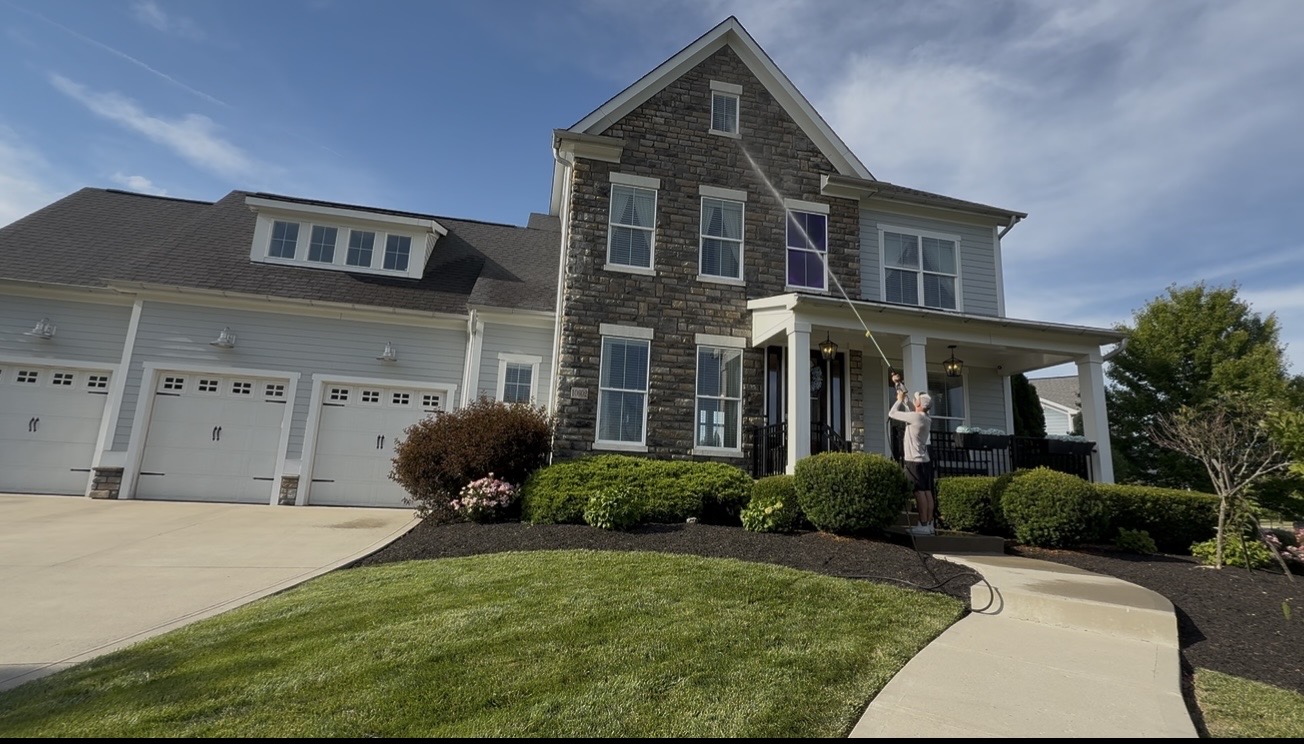 Mullet Power Wash rinsing the exterior windows and facade of a Central Ohio home