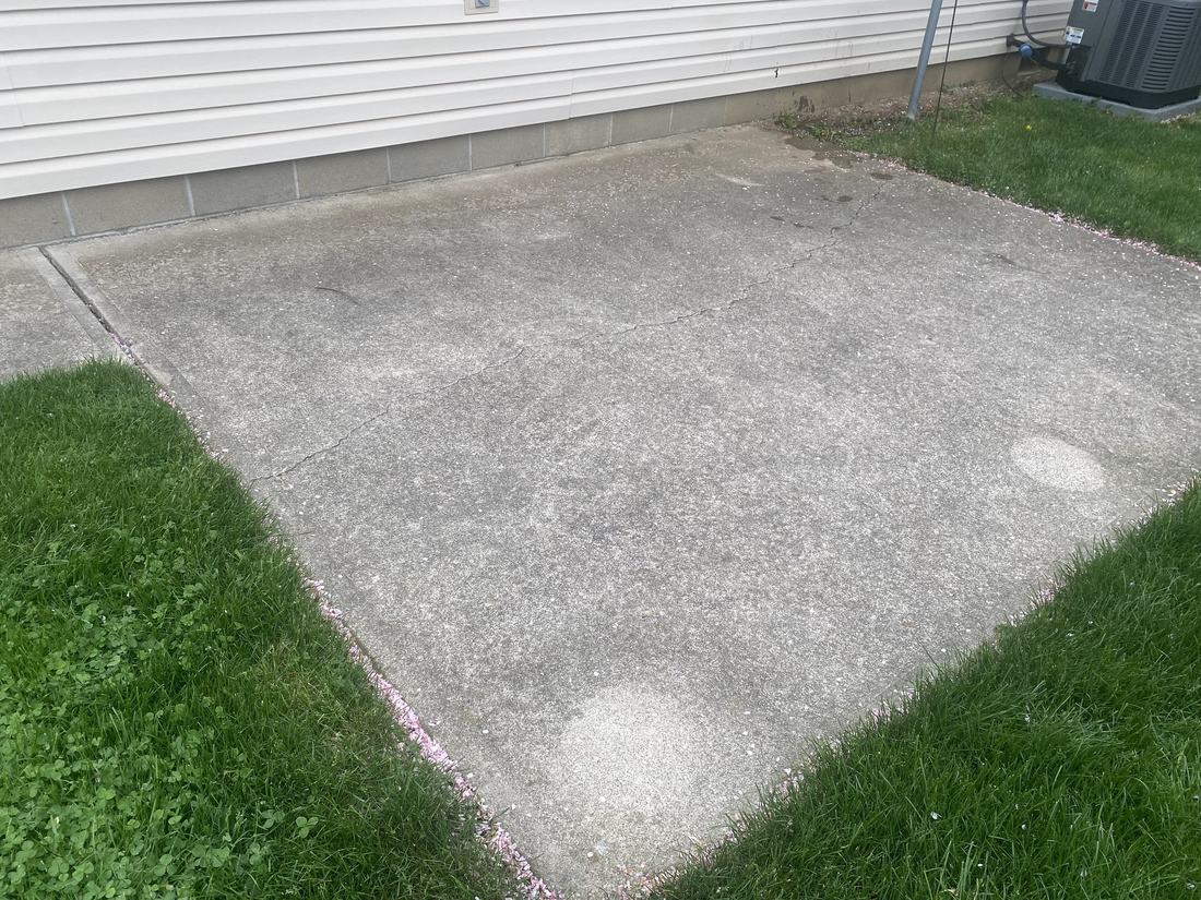 Back concrete pad before washing