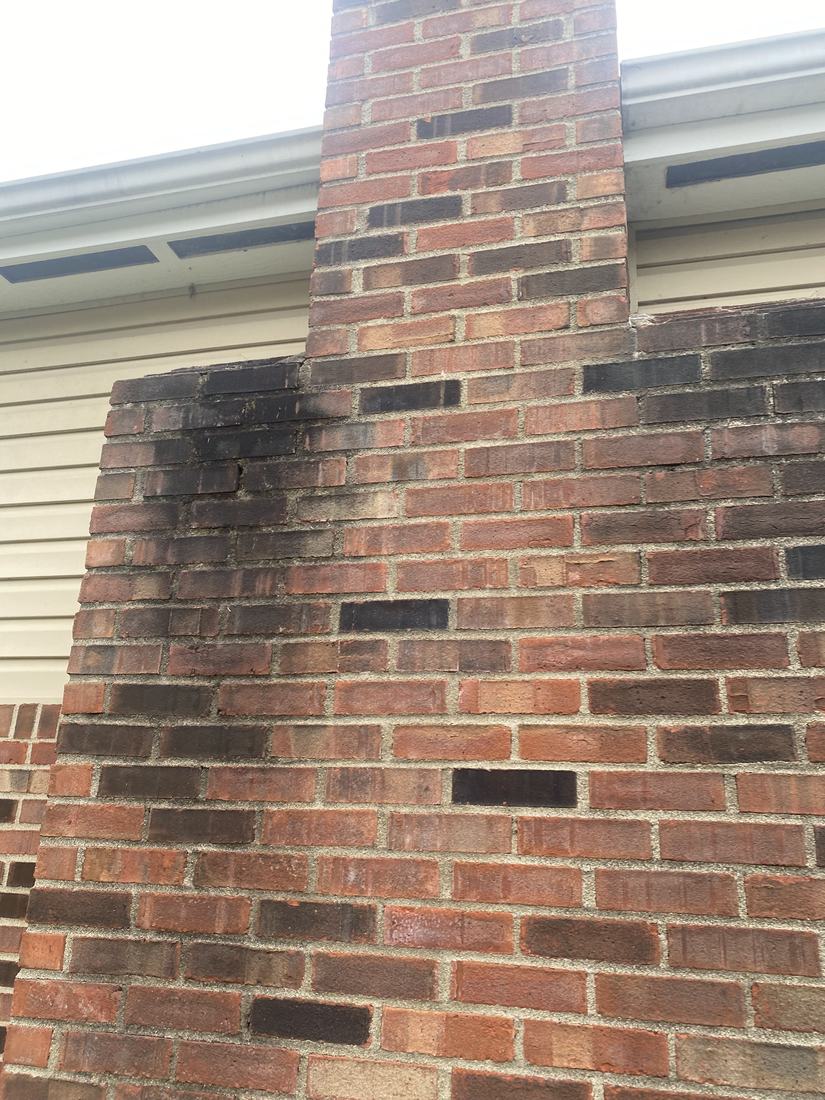 Brick chimney and foundation before washing
