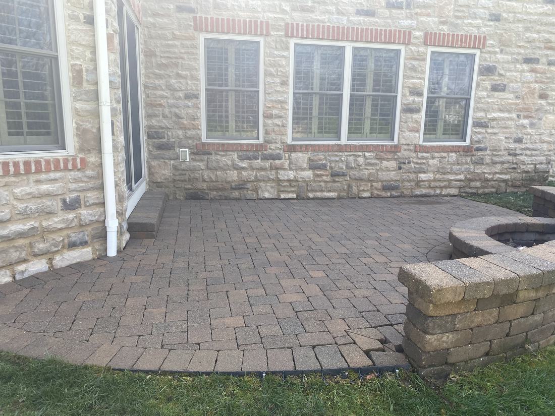 Brick courtyard and fire pit after washing by Mullet Power Wash