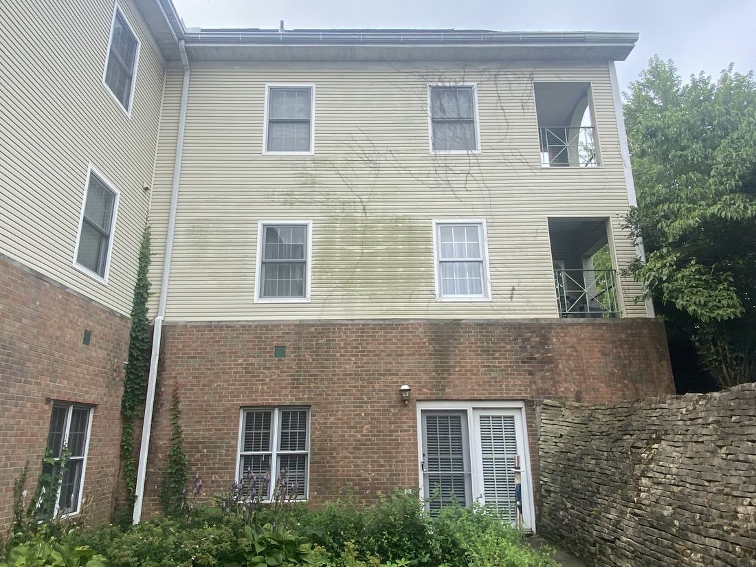 Three-story condominium building before washing