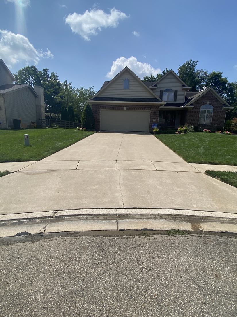 Driveway and front of home after washing by Mullet Power Wash