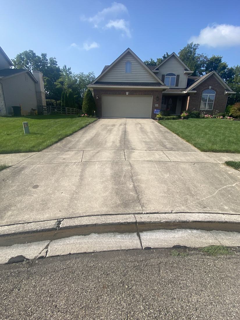 Driveway and front of home before washing