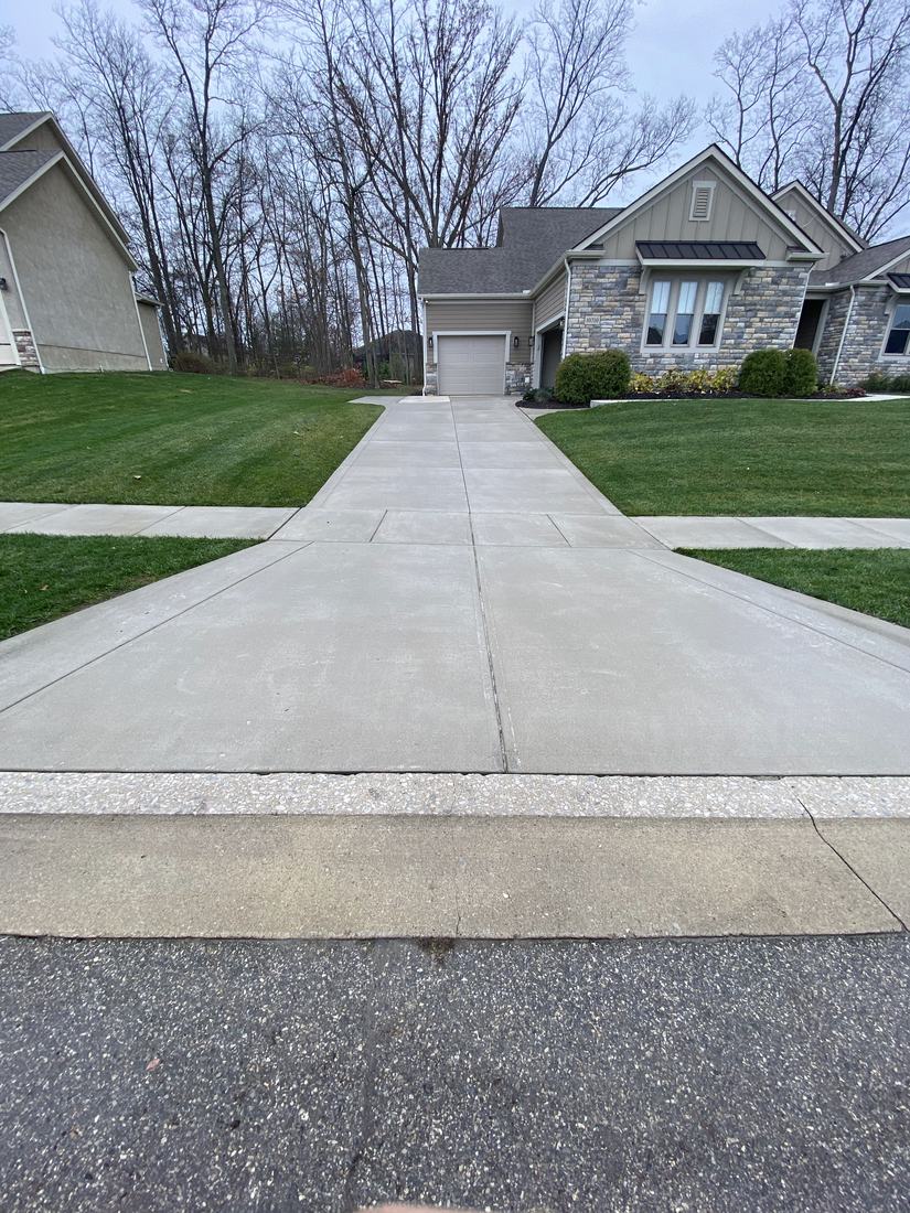 Long concrete driveway washed to an even finish in Central Ohio
