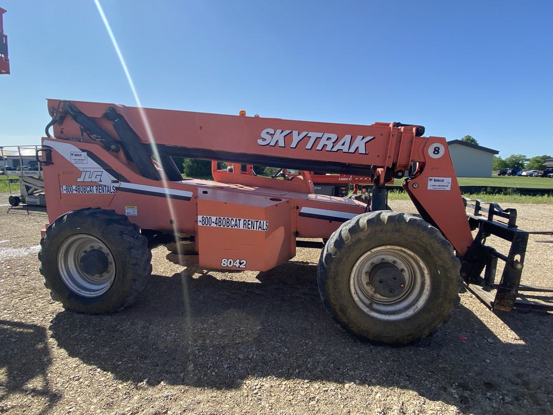 Orange telehandler washed on a gravel lot in Central Ohio