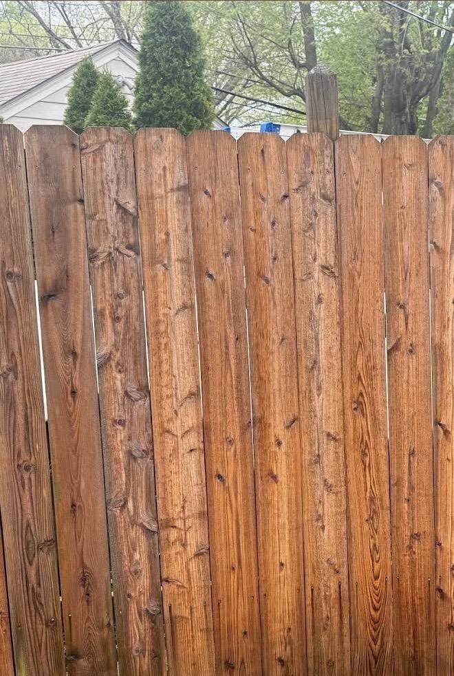 A wood privacy fence after fence washing by Mullet Power Wash
