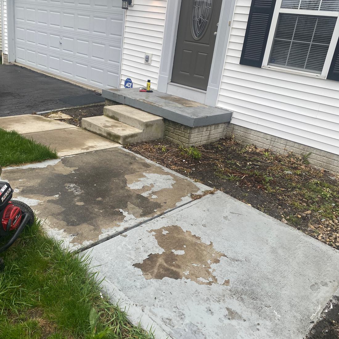 Front walk and stoop, oil stain out before washing