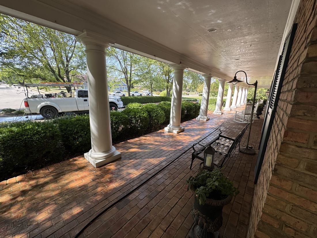 Long brick porch with columns cleaned by Mullet Power Wash in Central Ohio