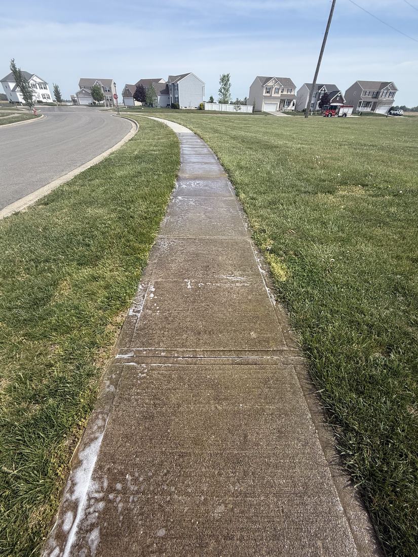Sidewalk, caught mid-wash before washing