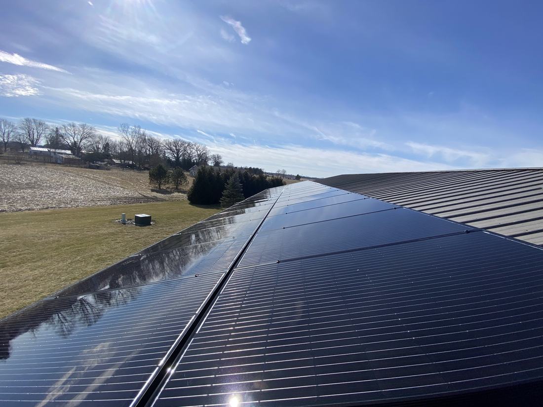 Clean solar panel array on a metal barn roof in rural Central Ohio