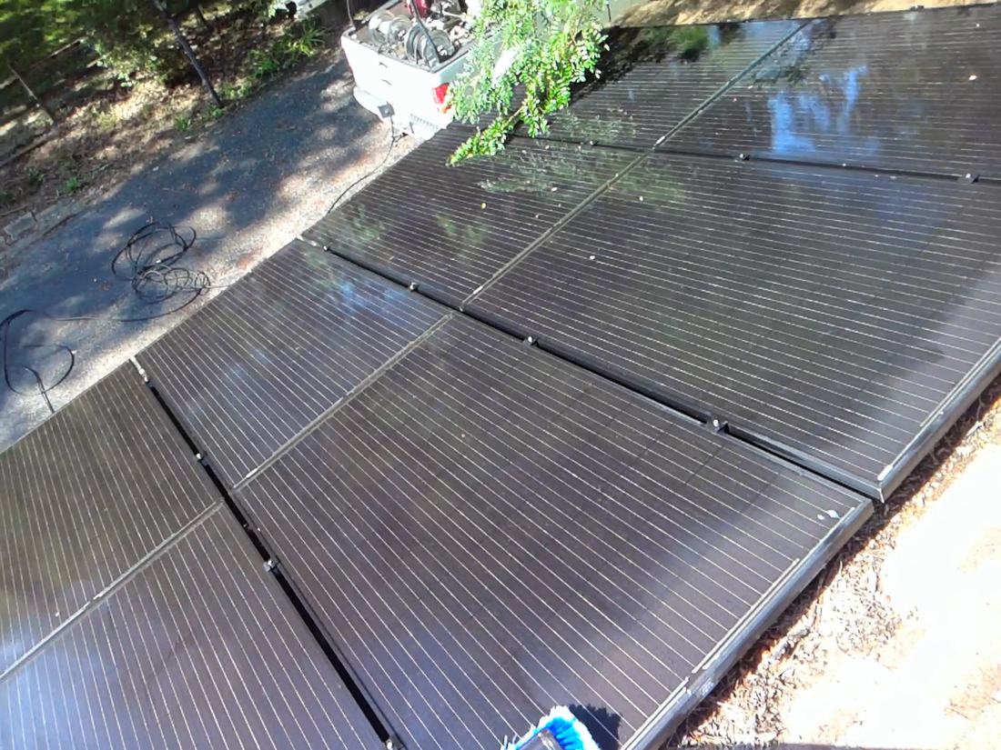 A row of clean residential solar panels after washing in Central Ohio
