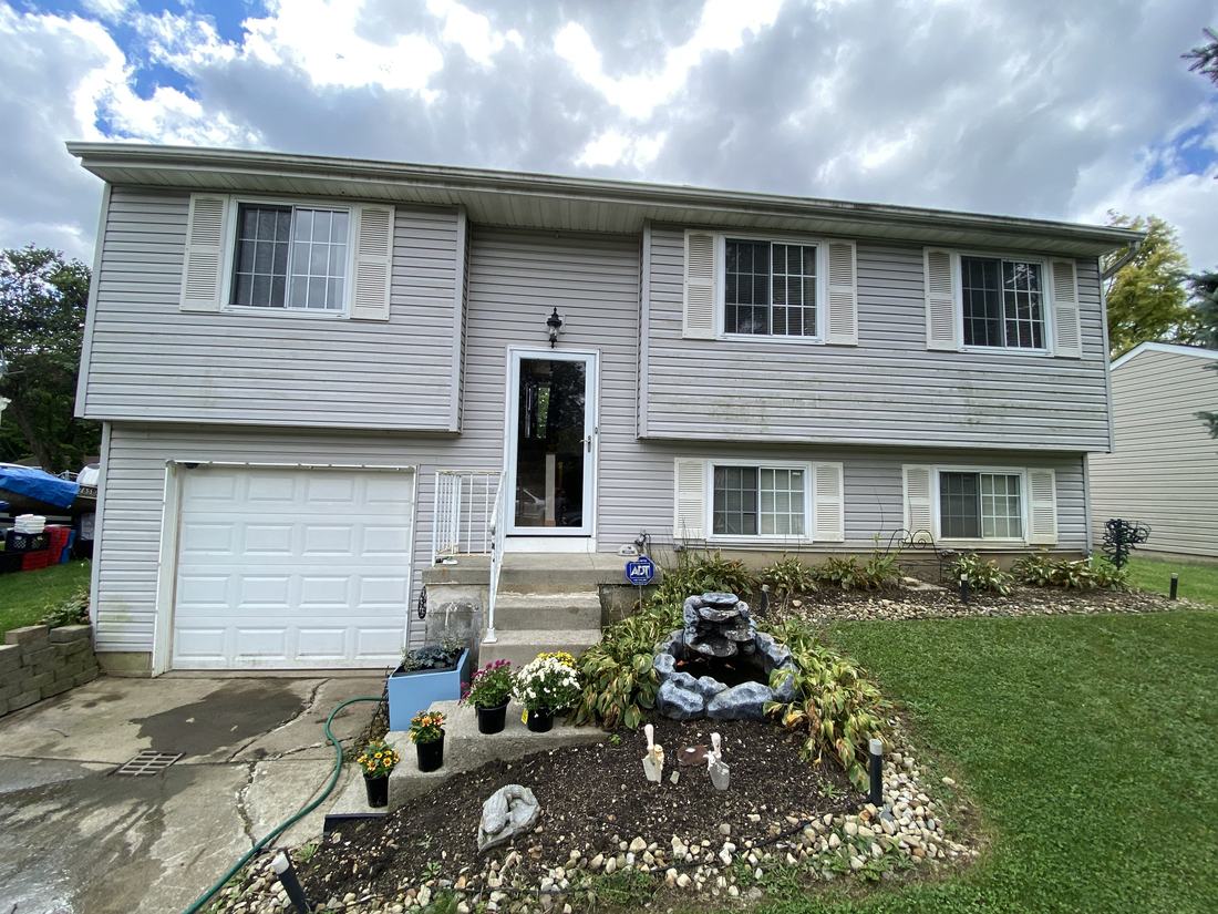 Split-level home, front before washing