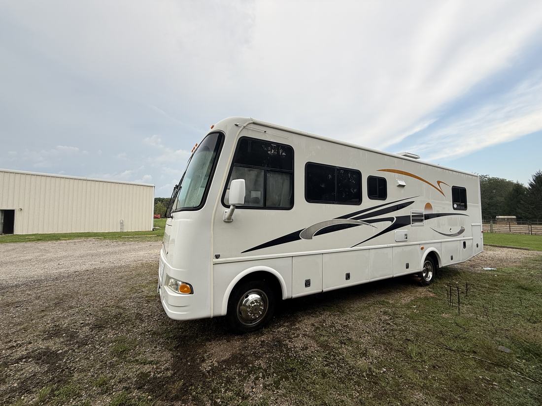 Clean white Class A motorhome, front quarter view, after washing in Central Ohio