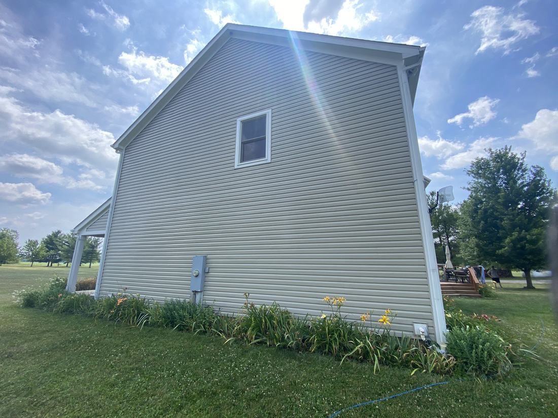 Vinyl gable end after washing by Mullet Power Wash