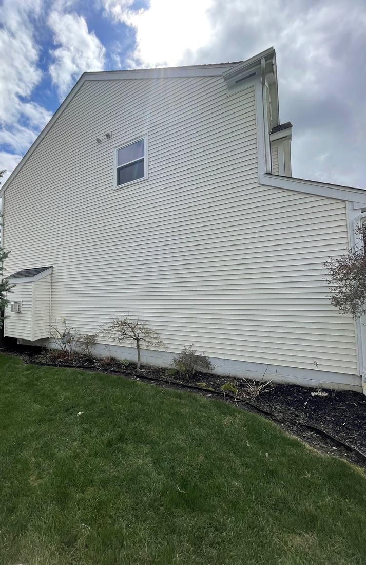 White vinyl, side elevation after washing by Mullet Power Wash