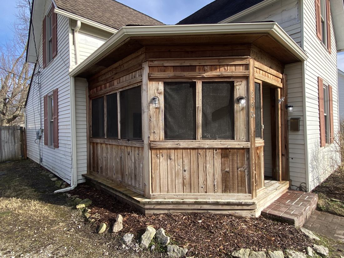 Wood screened porch after washing by Mullet Power Wash