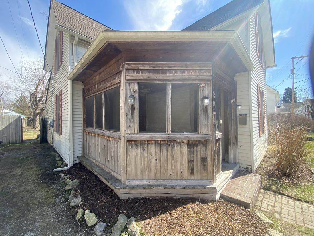 Wood screened porch before washing
