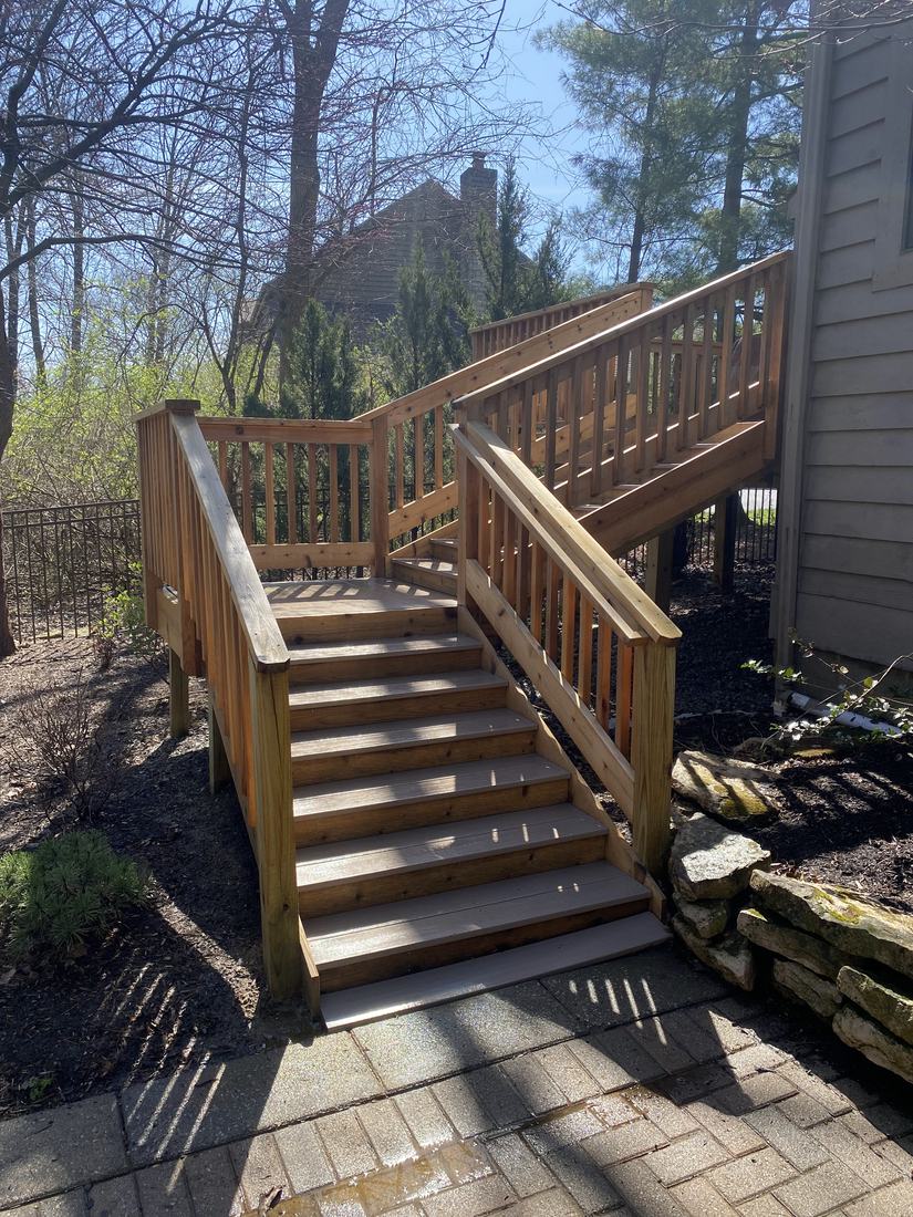 Wooden stairs and railing after washing by Mullet Power Wash