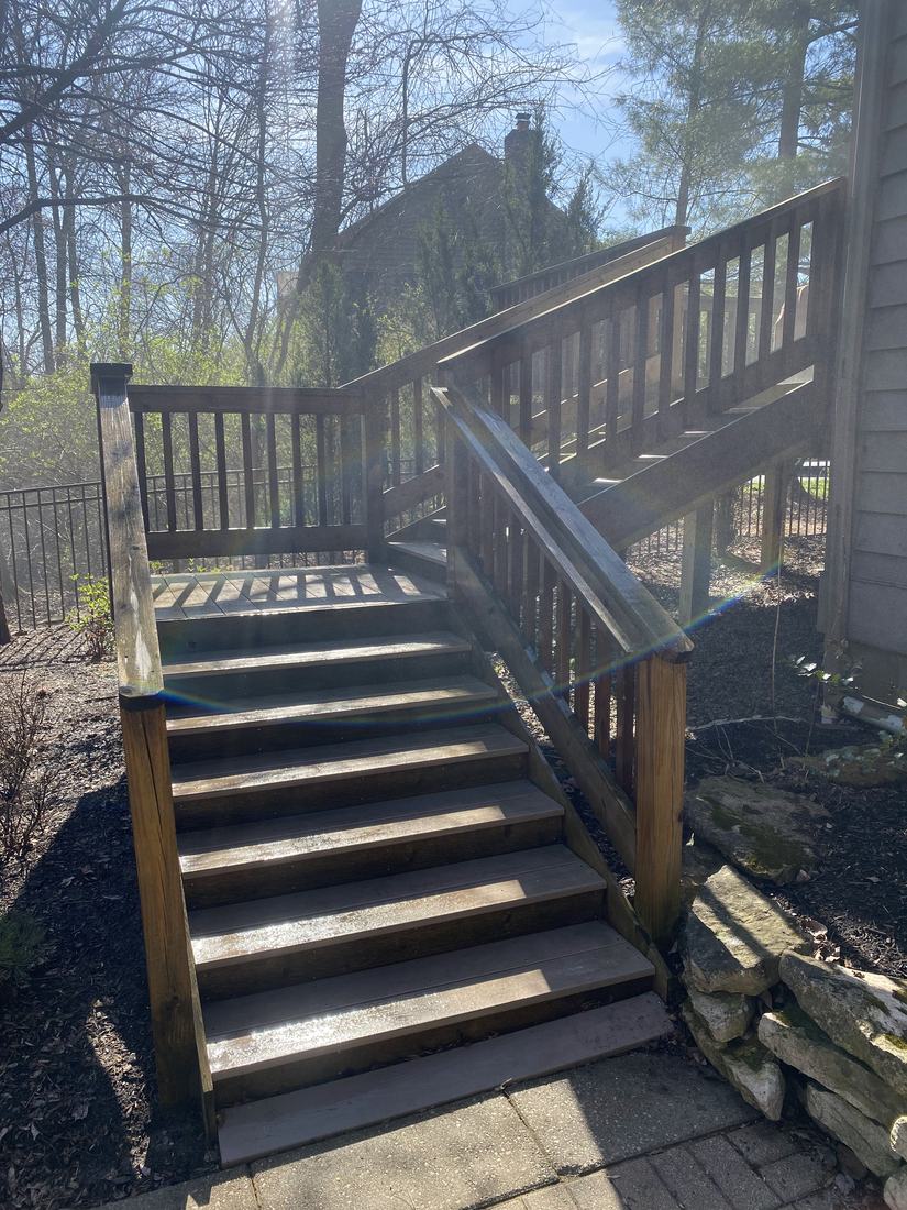 Wooden stairs and railing before washing